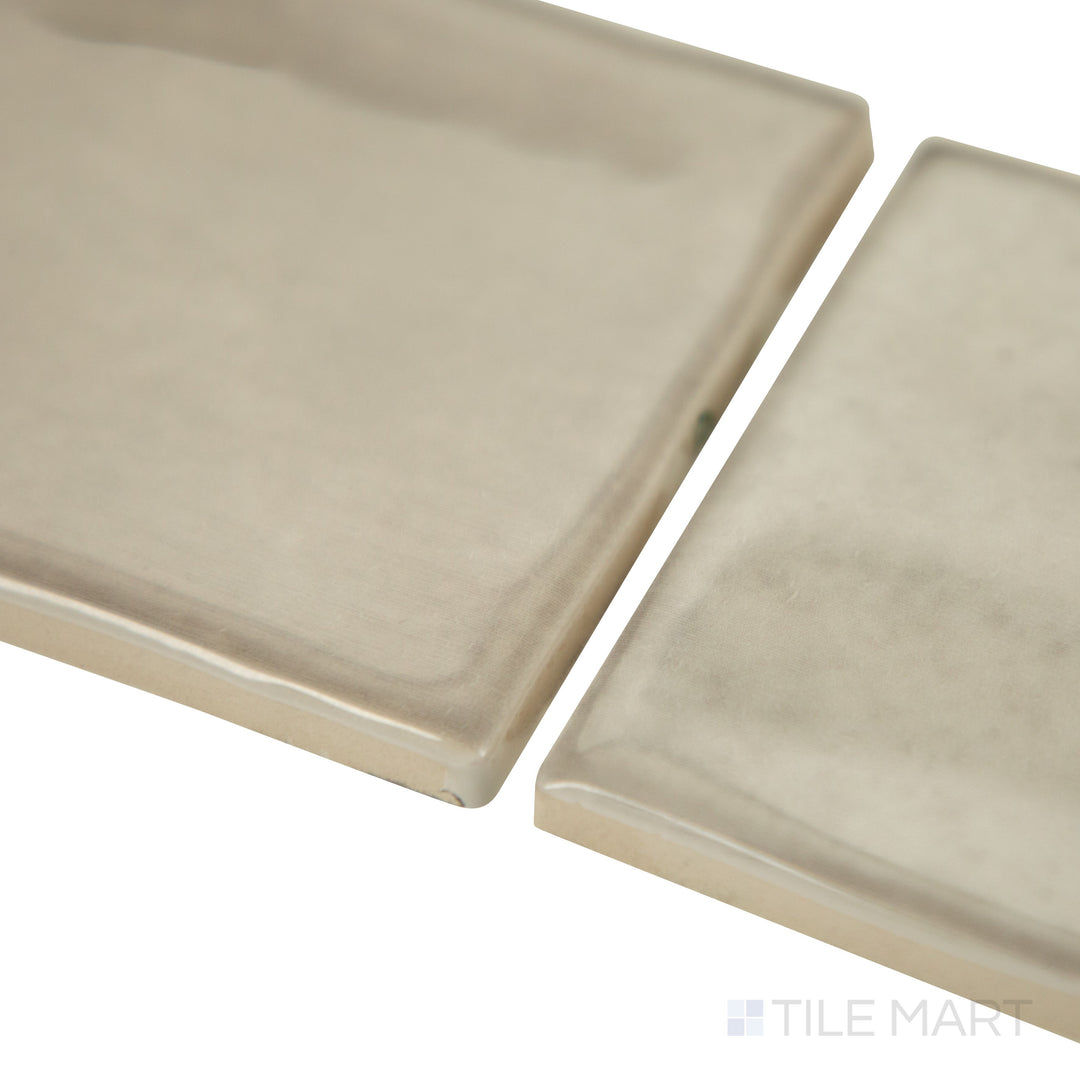 Slanted perspective of Mesmerist Trance 3x12 glossy glazed ceramic tile, emphasizing its rich color, smooth glossy texture, and structured rectangular format.  