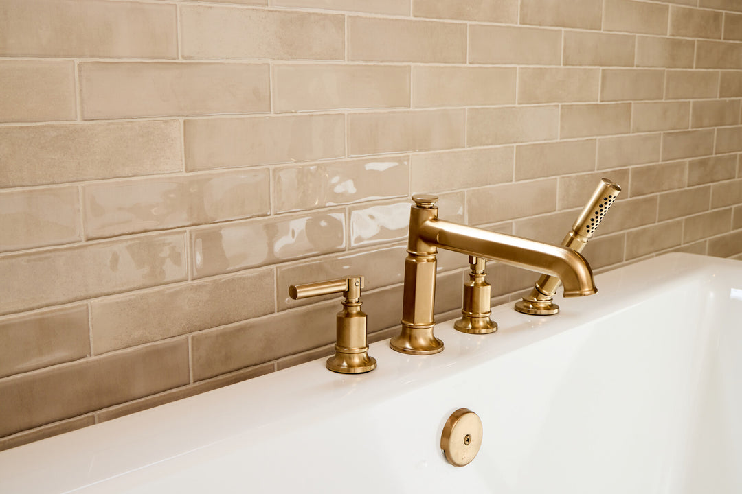 Mesmerist Trance 3x12 glossy glazed ceramic tile shines with clarity and depth, drawing attention through its sleek linear form and high-gloss finish.