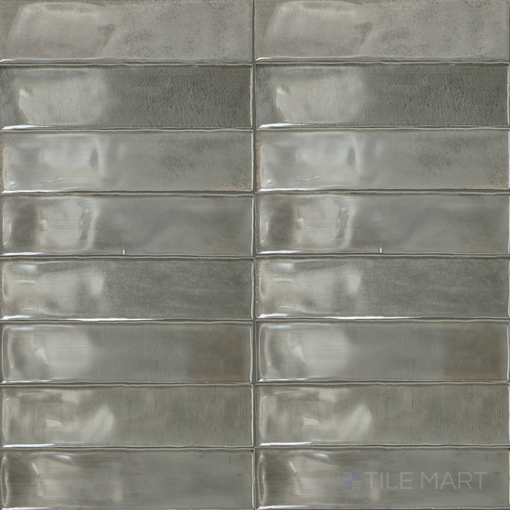 An overview of Mesmerist Charm 3x12 glossy glazed ceramic tiles, highlighting their smooth surface and elegant sheen.