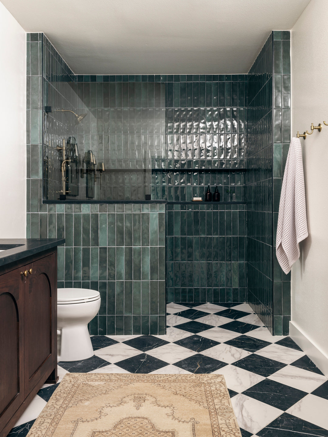 Defined by its modern gloss and clean lines, the Mesmerist Allure 3x12 glossy glazed ceramic tile enhances the space with a polished, elongated form.