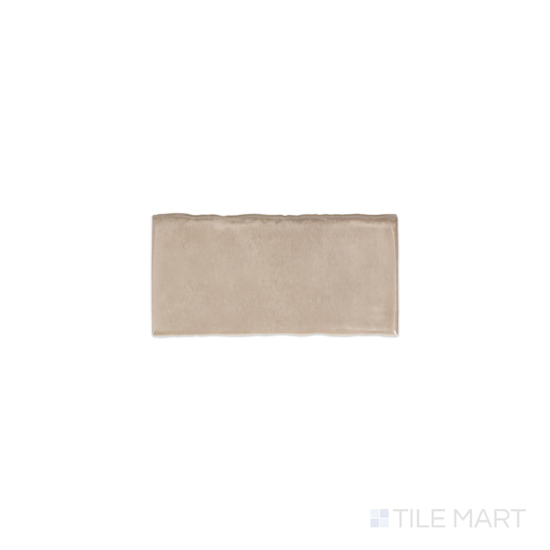 Angled shot of Mesmerist Trance 3x6 glossy glazed ceramic tile, featuring a deep color, high-gloss reflective surface, and a structured rectangular format.  