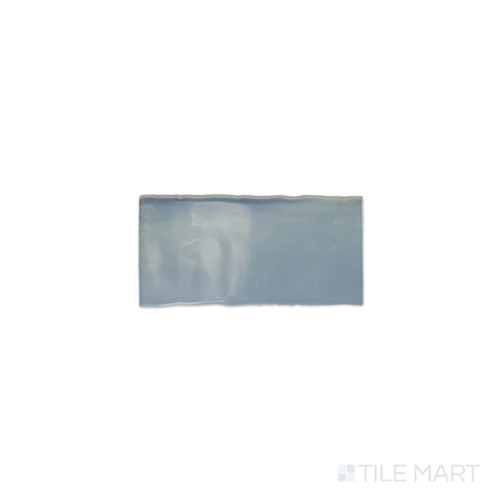 The overhead perspective features the Mesmerist Whimsy 3x6 glossy glazed ceramic tile, displaying a radiant, glossy glaze that reflects light beautifully for a vibrant look.