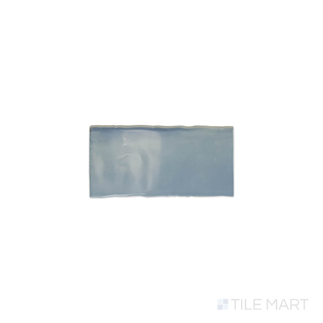 The overhead perspective features the Mesmerist Whimsy 3x6 glossy glazed ceramic tile, displaying a radiant, glossy glaze that reflects light beautifully for a vibrant look.