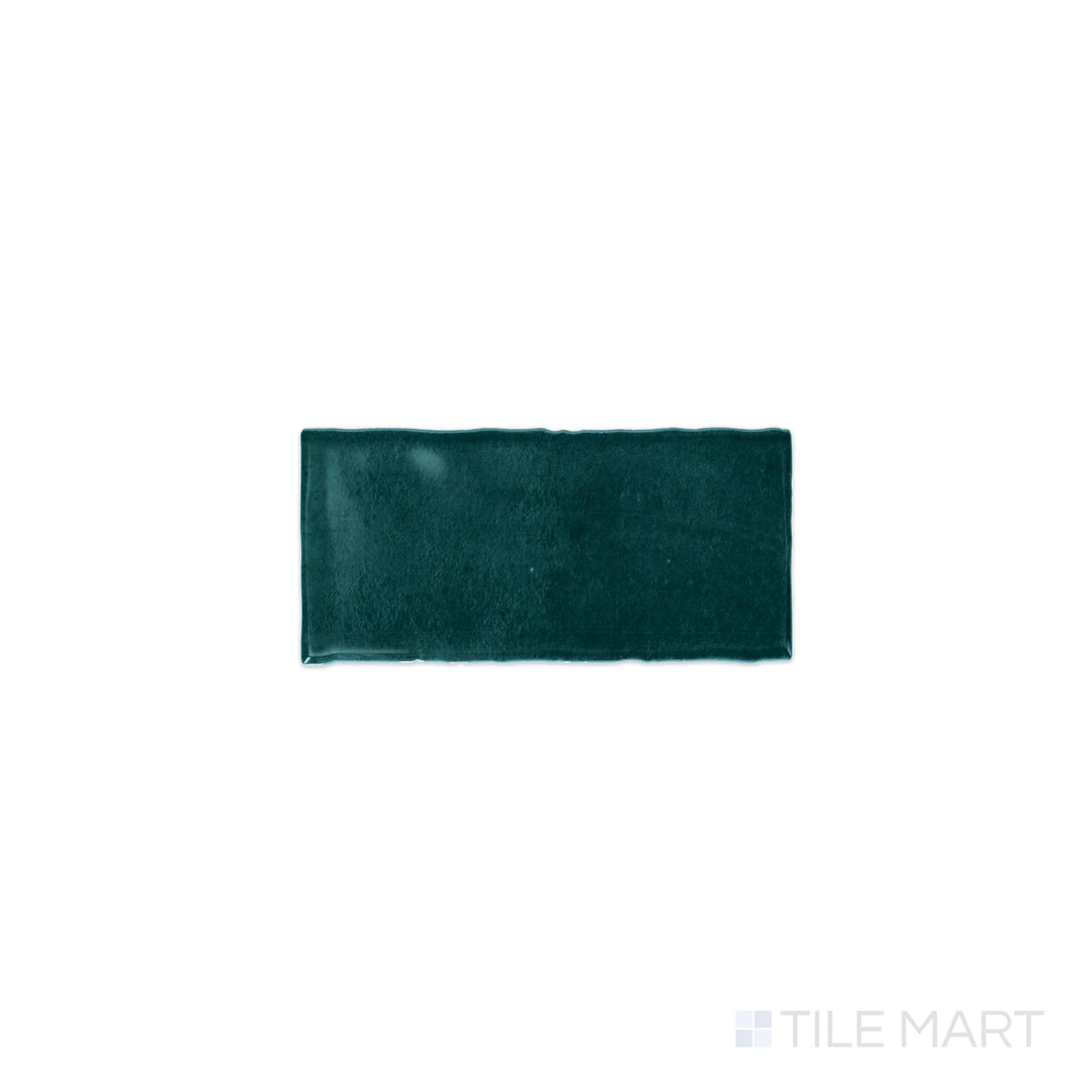 Diagonal view of Mesmerist Mystique 3x6 glossy glazed ceramic tile, showcasing a rich, polished glossy finish, elegant rectangular shape, and a modern aesthetic.  