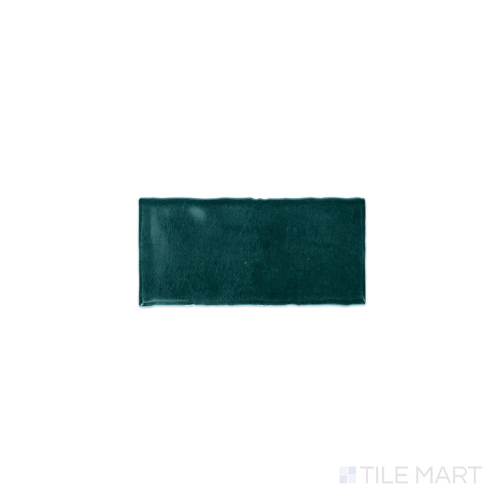 Diagonal view of Mesmerist Mystique 3x6 glossy glazed ceramic tile, showcasing a rich, polished glossy finish, elegant rectangular shape, and a modern aesthetic.  