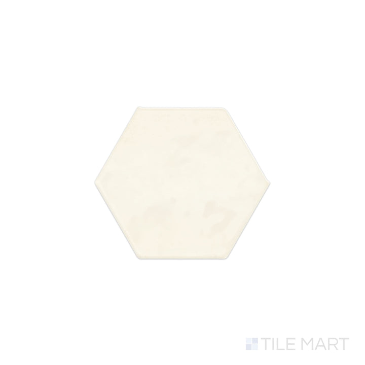 Viewed from the top, the Mesmerist Spirit 4" hex glossy glazed ceramic tile presents a striking hexagonal shape with a reflective surface, creating a bold and modern aesthetic.