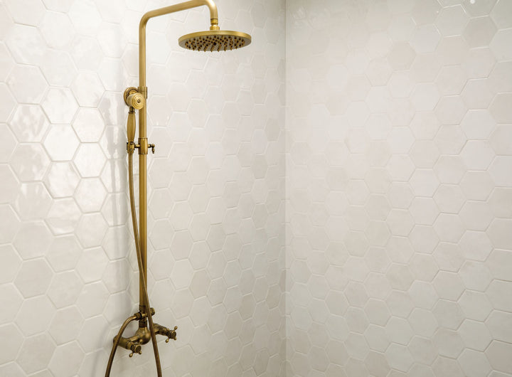 Seen in a room environment, the Mesmerist Spirit 4 inch hex glossy glazed ceramic tile introduces geometric interest with a glossy surface