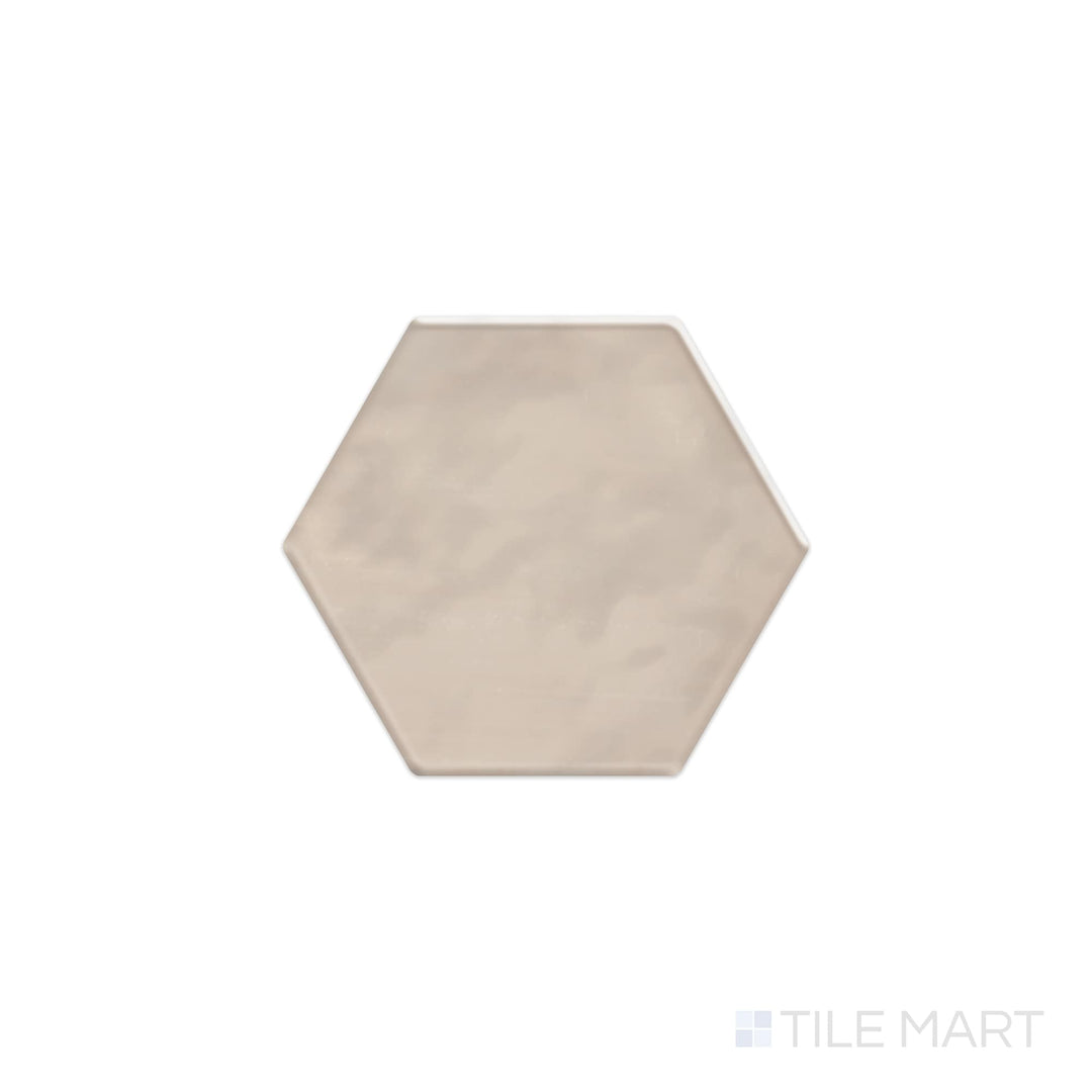 A top-down view of the Mesmerist Trance 4" hex glossy glazed ceramic tile reveals a sleek hexagon design with a high-gloss glaze, adding depth and dimension to any space.