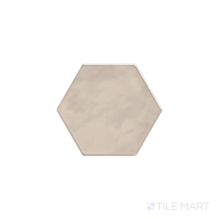 A top-down view of the Mesmerist Trance 4" hex glossy glazed ceramic tile reveals a sleek hexagon design with a high-gloss glaze, adding depth and dimension to any space.