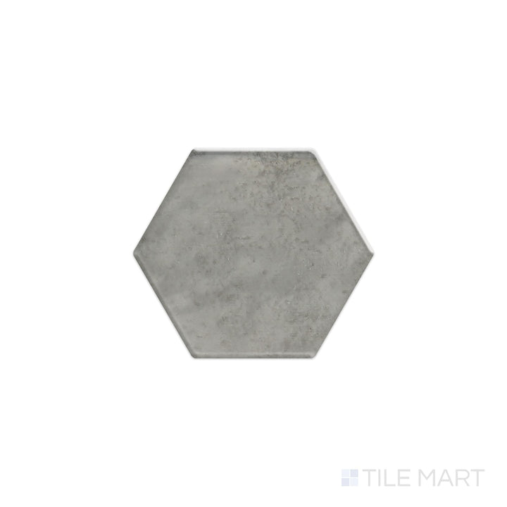 Captured from above, the Mesmerist Charm 4" hex glossy glazed ceramic tile showcases a polished surface and geometric hexagonal form, offering a sophisticated touch to walls and floors.