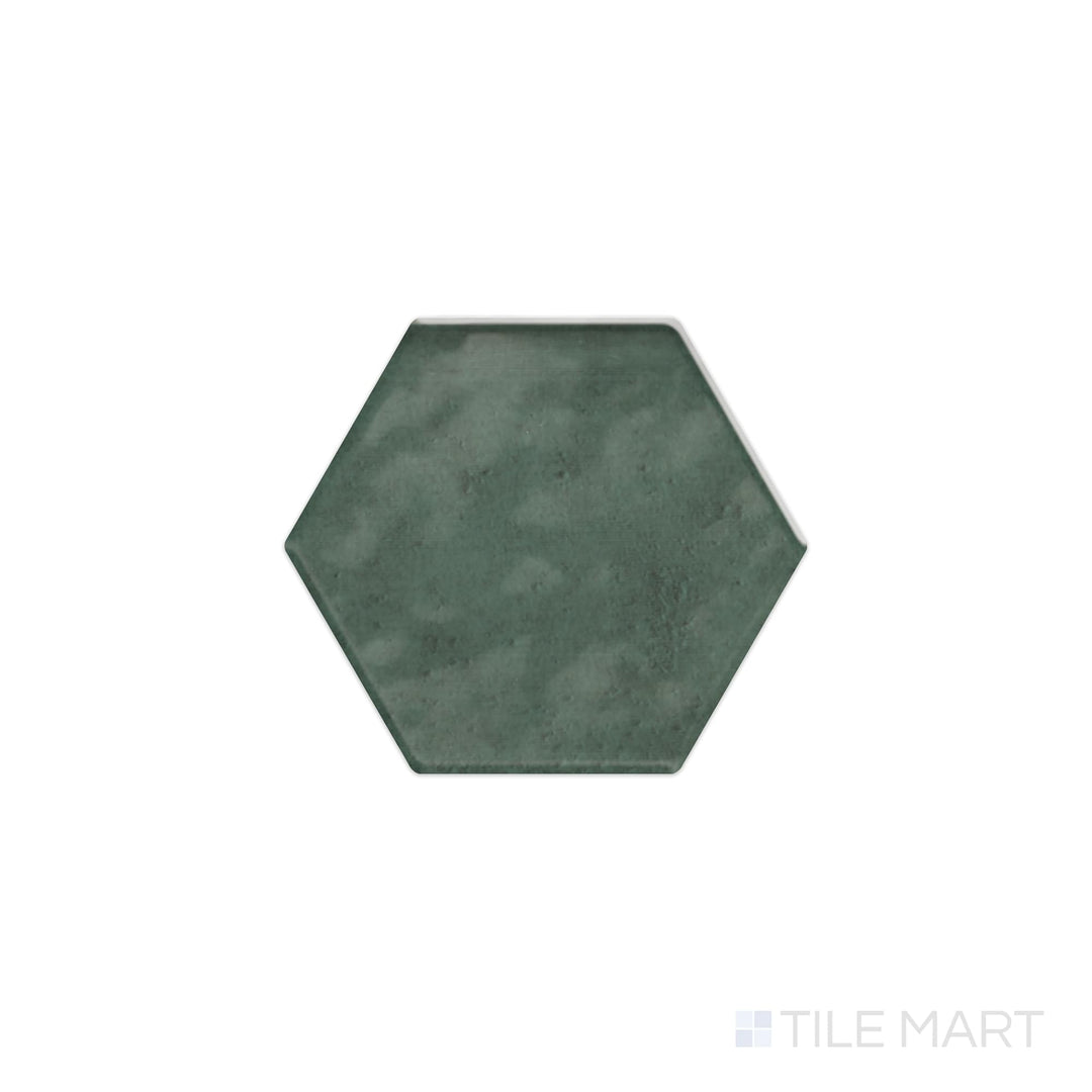 The overhead perspective highlights the Mesmerist Allure 4" hex glossy glazed ceramic tile, with its luminous glaze and crisp hexagonal shape, perfect for modern and artistic designs.