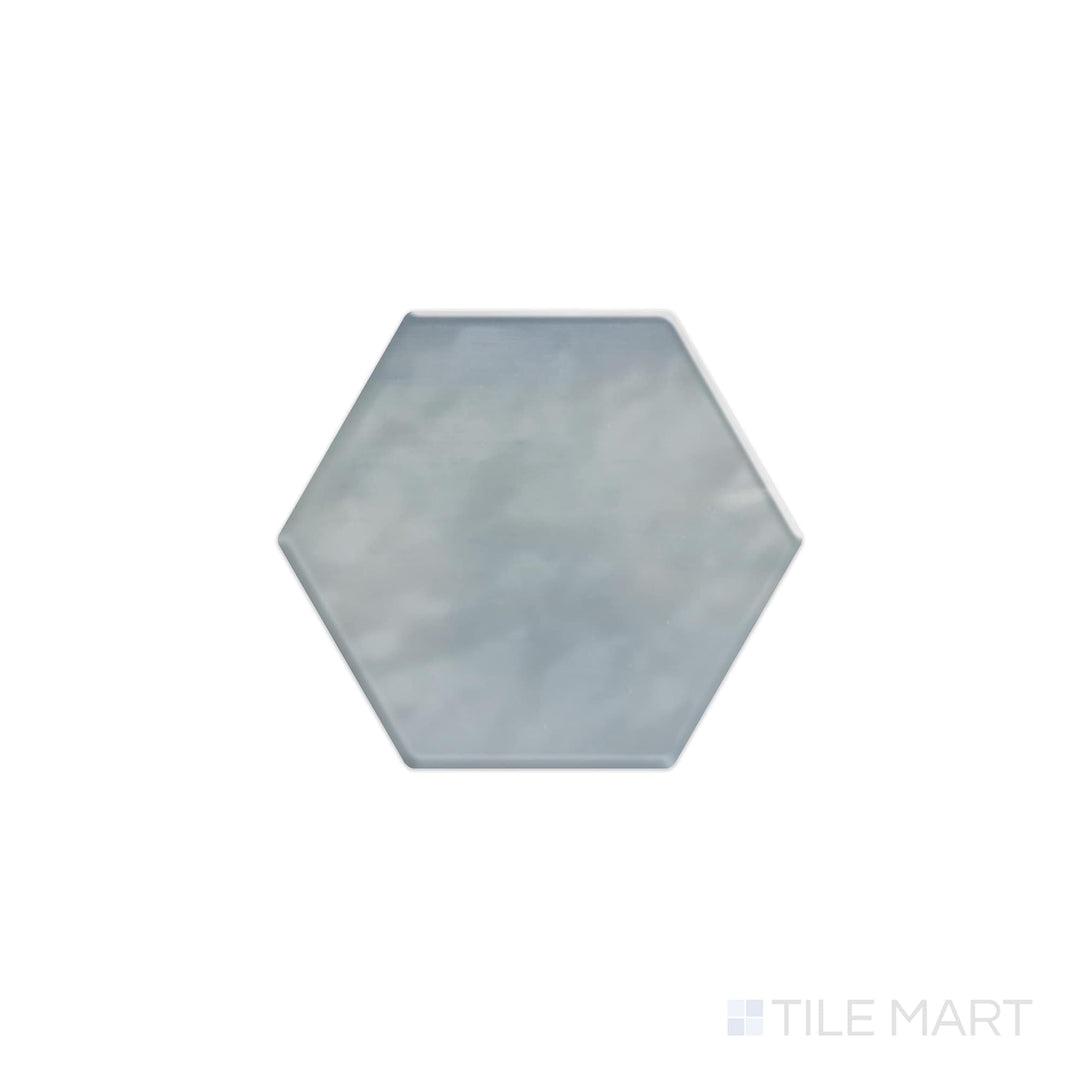 Viewed from the top, the Mesmerist Whimsy 4" hex glossy glazed ceramic tile displays a playful yet elegant hexagonal form with a glossy surface, enhancing light and texture in any setting.