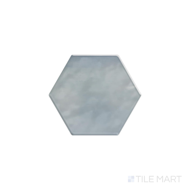 Viewed from the top, the Mesmerist Whimsy 4" hex glossy glazed ceramic tile displays a playful yet elegant hexagonal form with a glossy surface, enhancing light and texture in any setting.
