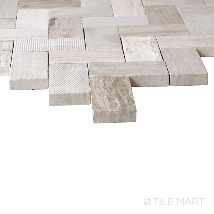 Corner shot of Minute Mosaix Chenille White Herringbone Marble, Limestone Mosaic, showcasing its elegant white tones with a classic herringbone pattern.