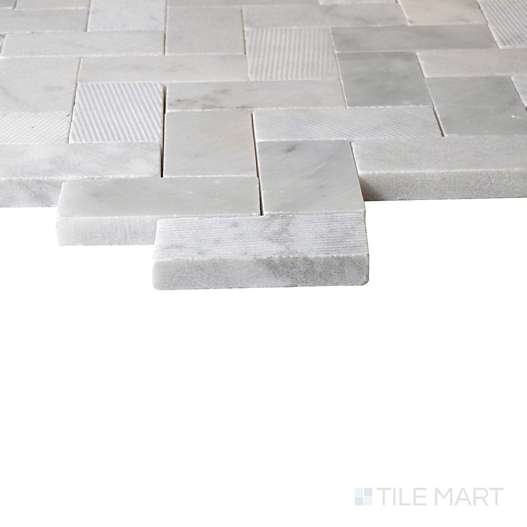 Angled view of Minute Mosaix Carrara White Herringbone Marble, Limestone Mosaic, highlighting its timeless Carrara marble design in a refined herringbone layout.