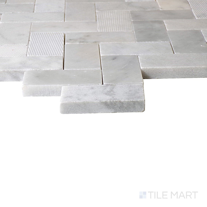 Angled view of Minute Mosaix Carrara White Herringbone Marble, Limestone Mosaic, highlighting its timeless Carrara marble design in a refined herringbone layout.