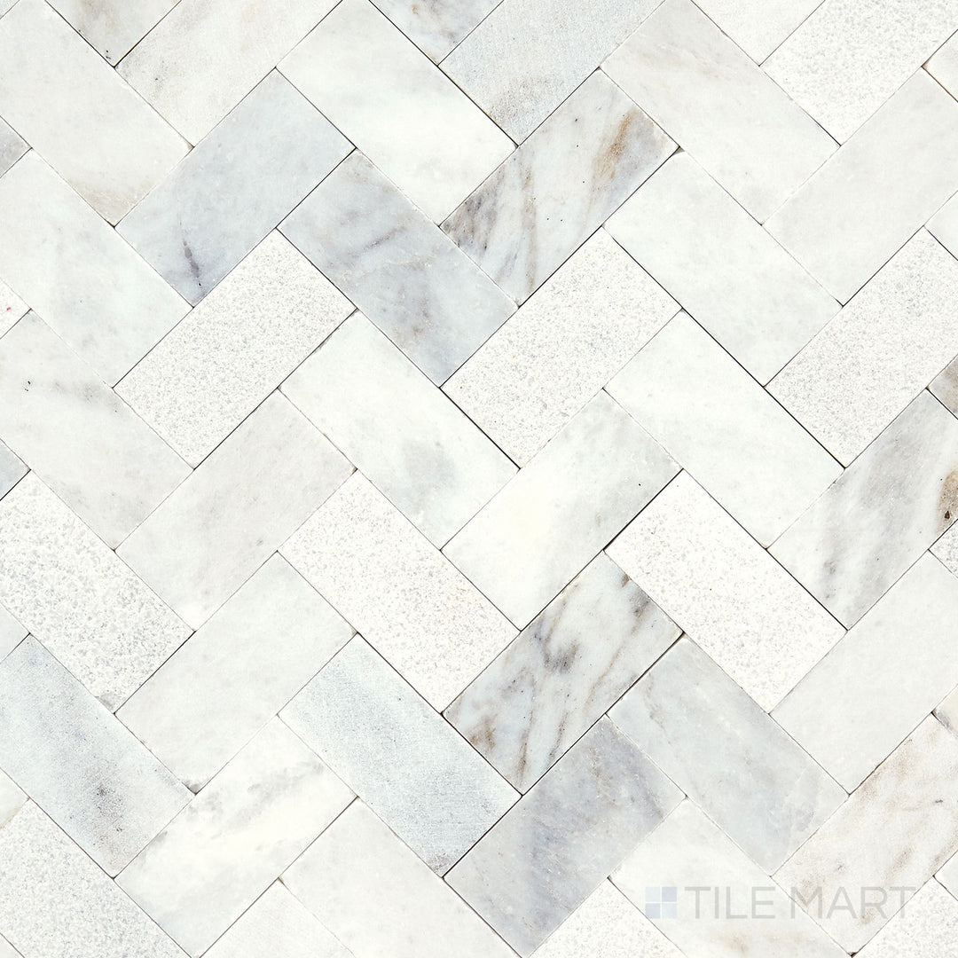 Direct overhead view of the Minute Mosaix Daphne White Herringbone marble and limestone mosaic, highlighting its crisp white hues and polished finish.
