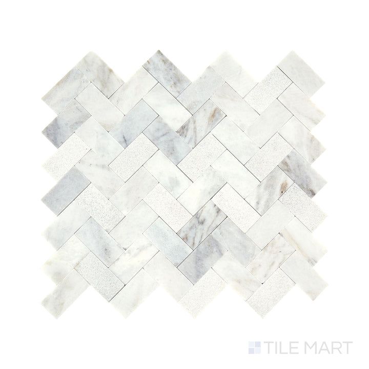 Angled shot of Minute Mosaix Daphne White herringbone marble limestone mosaic, featuring subtle white and gray tones, a delicate herringbone arrangement, and a smooth natural limestone feel.  