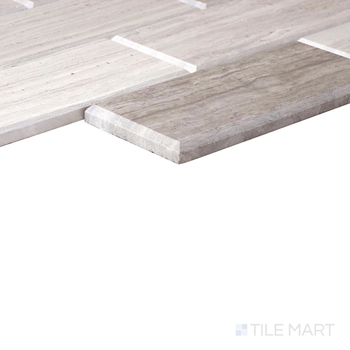 Angled close-up of Simplystick Mosaix Chenille White Honed Marble, Limestone Mosaic, showcasing its smooth, honed white marble tones with subtle texture.