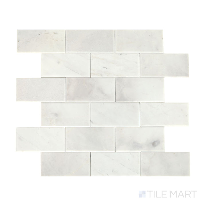 Slanted perspective of Simplystick Mosaix Stormy Mist honed marble limestone mosaic, emphasizing its deep gray hues, refined honed surface, and structured design.  