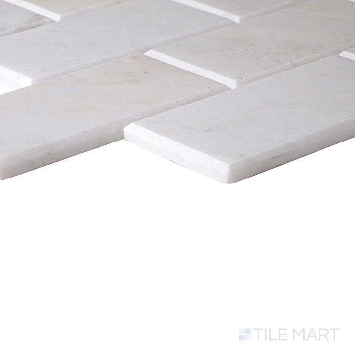 Corner-focused shot of Simplystick Mosaix Stormy Mist Honed Marble, Limestone Mosaic, highlighting its moody gray hues with a refined honed surface.