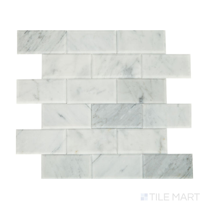Angled shot of Simplystick Mosaix Carrara White honed marble limestone mosaic, featuring elegant Carrara veining, a subtle honed finish, and a luxurious natural stone texture.  