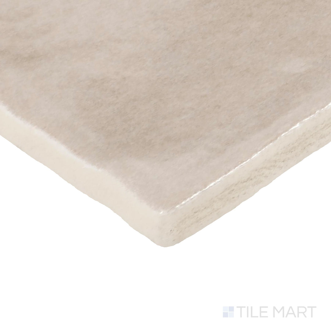 Close-up corner shot of Zellige Neo Lana 4X4 Glossy Glazed Ceramic Tile, featuring its warm beige tones with a rich, polished glaze.