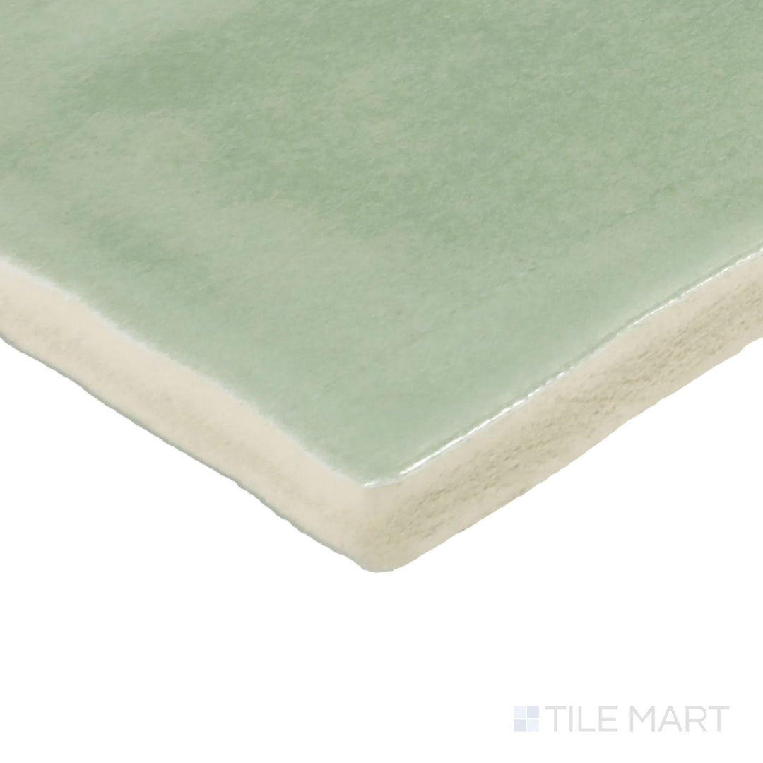 Corner angle of Zellige Neo Turchese 4X4 Glossy Glazed Ceramic Tile, emphasizing its vibrant turquoise hues with a reflective, glossy finish.