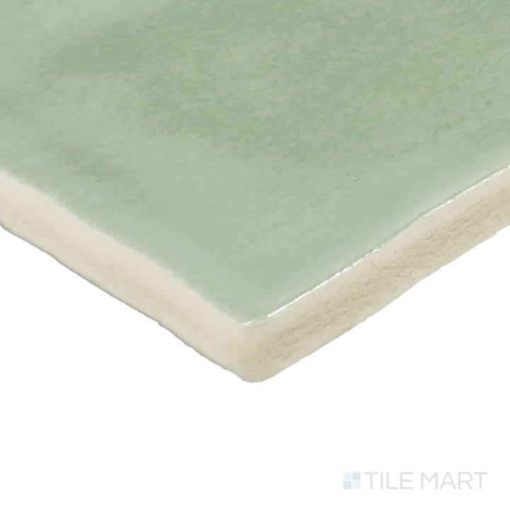 Corner angle of Zellige Neo Turchese 4X4 Glossy Glazed Ceramic Tile, emphasizing its vibrant turquoise hues with a reflective, glossy finish.