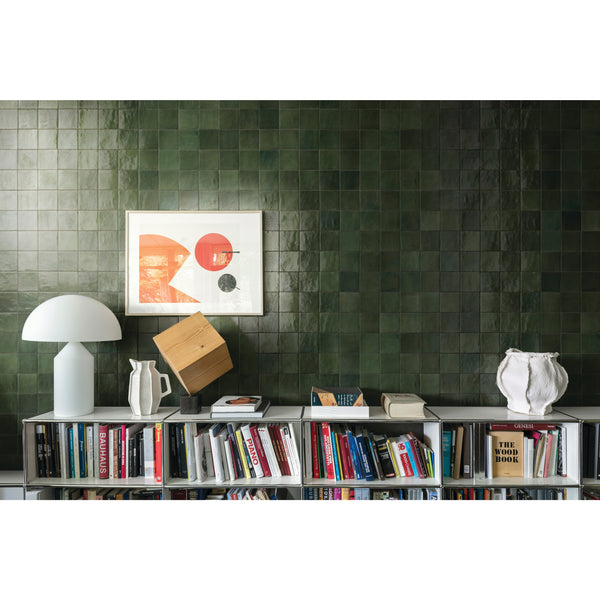 A deep forest green tone with a glossy finish creates a bold and organic feel in this Zellige Neo Bosco 4x4 glazed ceramic tile.