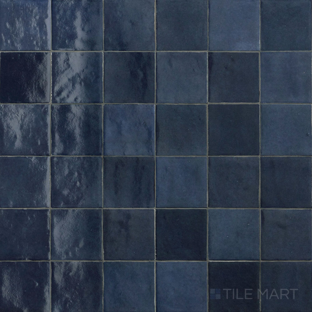 Top-down image of Zellige Neo China 4X4 Glossy Glazed Ceramic, showcasing its bold red hue and classic glazed ceramic surface.