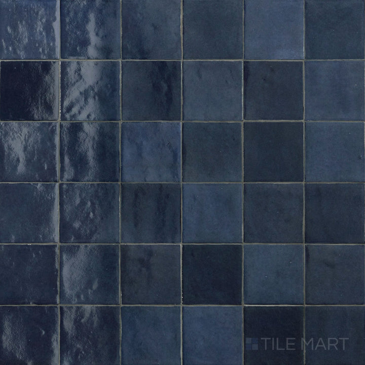 Top-down image of Zellige Neo China 4X4 Glossy Glazed Ceramic, showcasing its bold red hue and classic glazed ceramic surface.