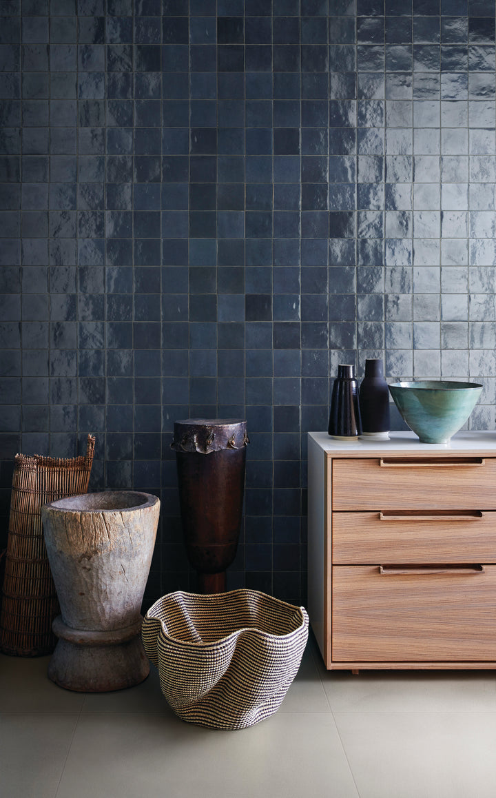 A soft off-white shade with a high-gloss glaze reflects light beautifully, adding warmth and brightness in this Zellige Neo China 4x4 glazed ceramic tile.