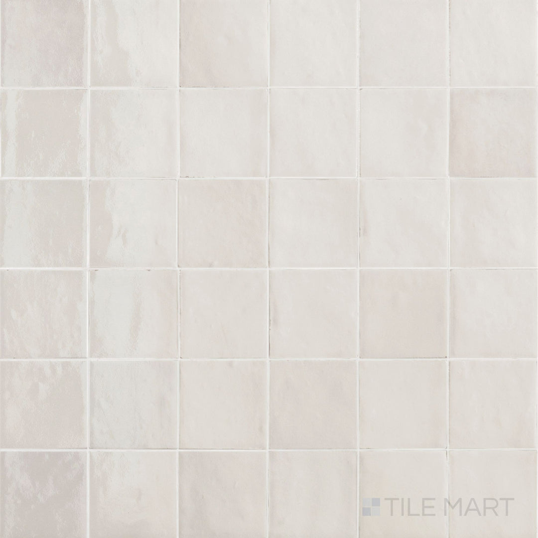 Flat-lay view of Zellige Neo Gesso 4X4 Glossy Glazed Ceramic, featuring its crisp white color and subtle handcrafted variations.