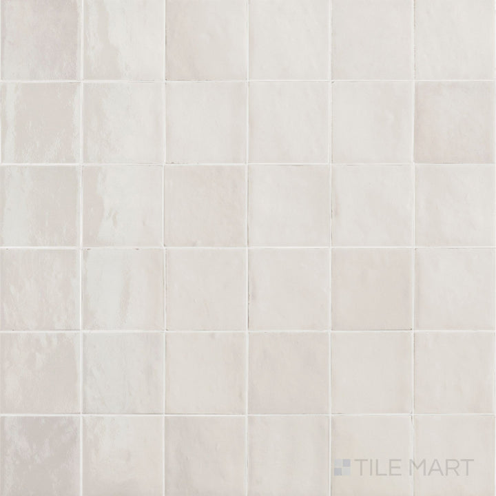 Flat-lay view of Zellige Neo Gesso 4X4 Glossy Glazed Ceramic, featuring its crisp white color and subtle handcrafted variations.