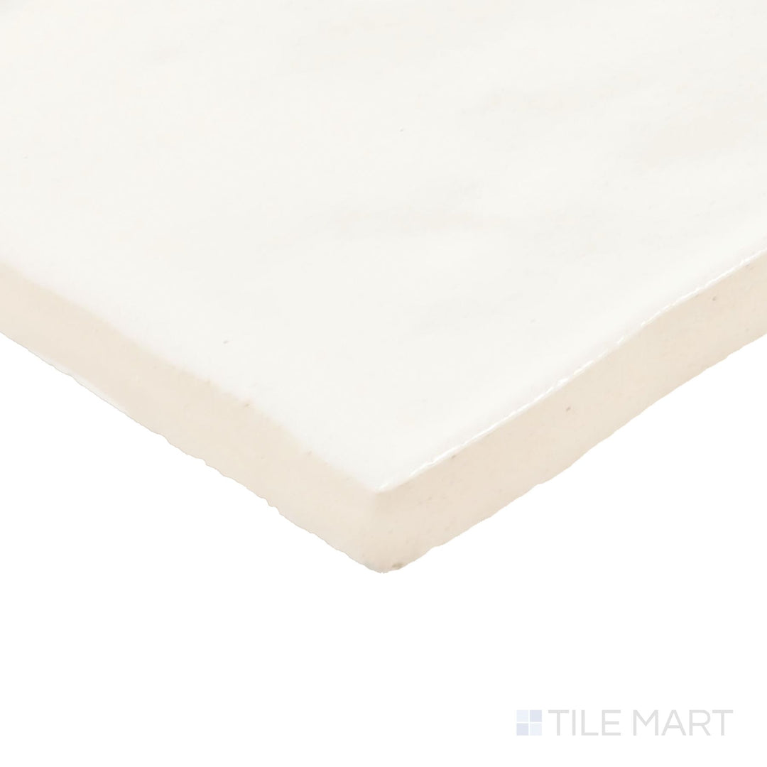 Close-up corner shot of Zellige Neo Gesso 4X4 Glossy Glazed Ceramic Tile, featuring its classic white shade with a glossy, handcrafted texture.