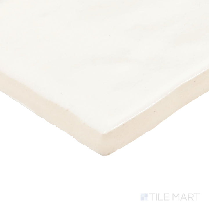 Close-up corner shot of Zellige Neo Gesso 4X4 Glossy Glazed Ceramic Tile, featuring its classic white shade with a glossy, handcrafted texture.