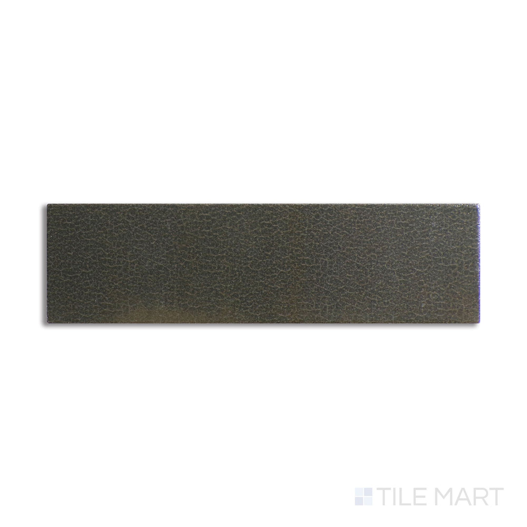 Slanted perspective of Inyo Olive 2x8 satin glazed ceramic tile, emphasizing its earthy green tone, a refined satin glaze, and a contemporary shape.  