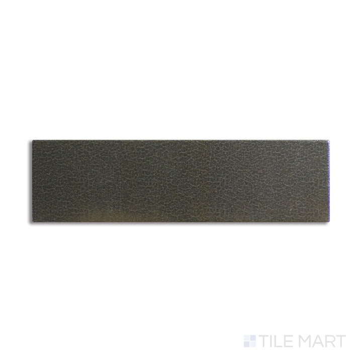 Slanted perspective of Inyo Olive 2x8 satin glazed ceramic tile, emphasizing its earthy green tone, a refined satin glaze, and a contemporary shape.  