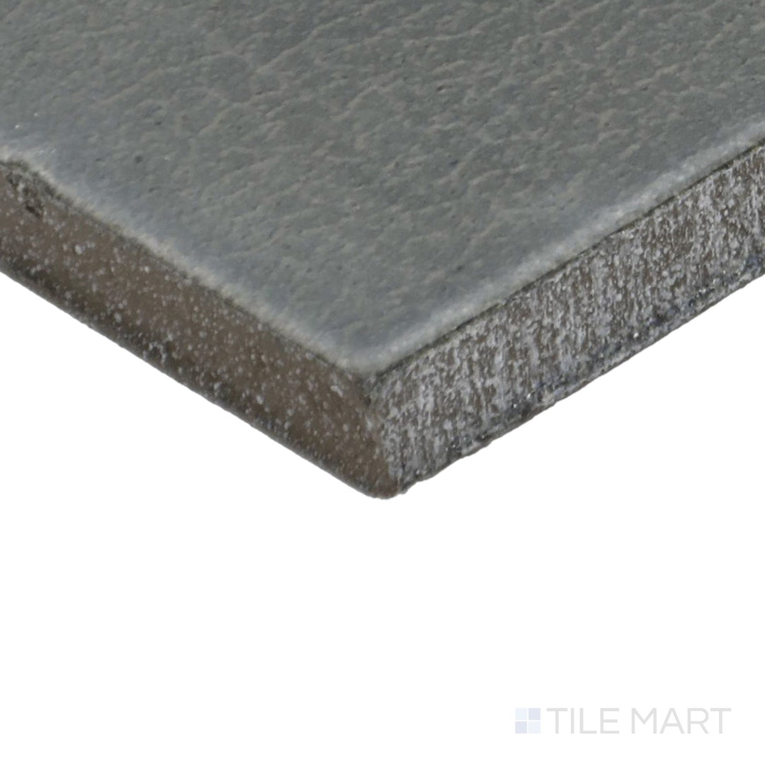 Close-up corner shot of Inyo Olive 2X8 Satin Glazed Ceramic Tile, featuring its earthy olive-green tones with a silky satin glaze.