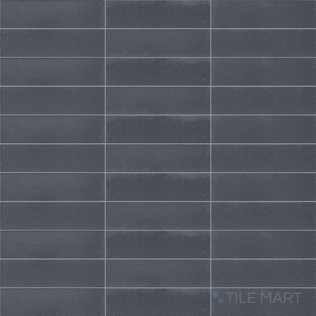 Direct top-down view of Inyo Indigo 2X8 Satin Glazed Ceramic, emphasizing its deep blue color and soft-textured finish.