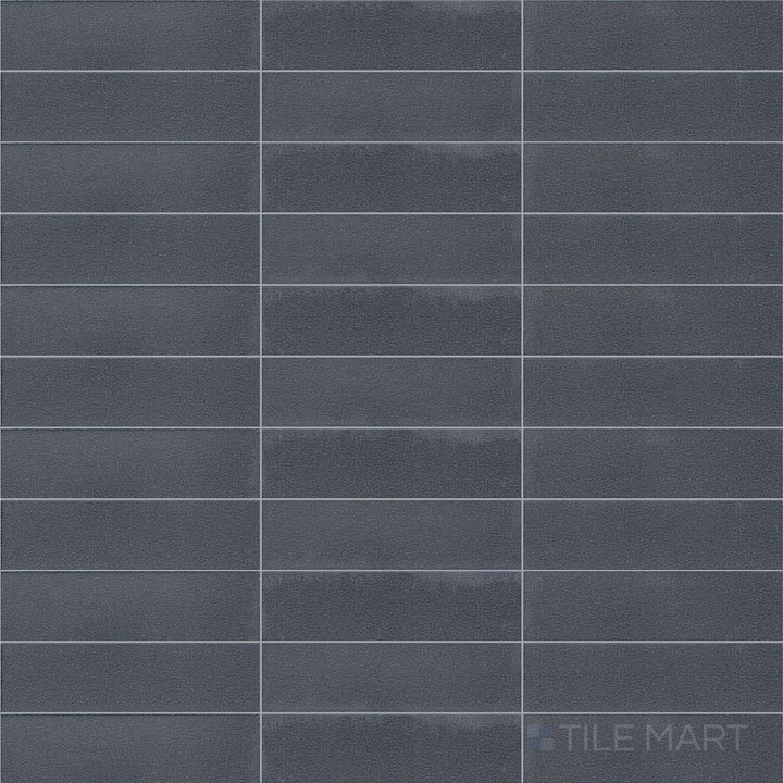 Direct top-down view of Inyo Indigo 2X8 Satin Glazed Ceramic, emphasizing its deep blue color and soft-textured finish.