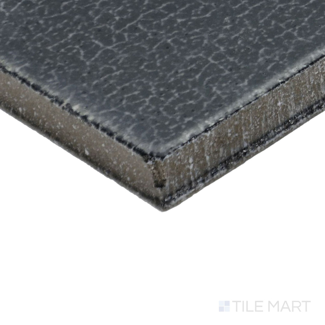 Corner angle of Inyo Indigo 2X8 Satin Glazed Ceramic Tile, emphasizing its deep indigo blue shades with a smooth satin surface.