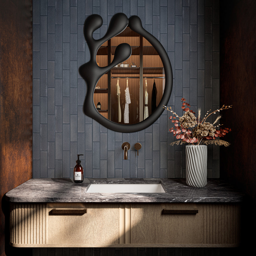 In this styled space, Inyo Indigo 2x8 satin glazed ceramic tile introduces deep color and a soft, velvety sheen with a modern rectangular layout.