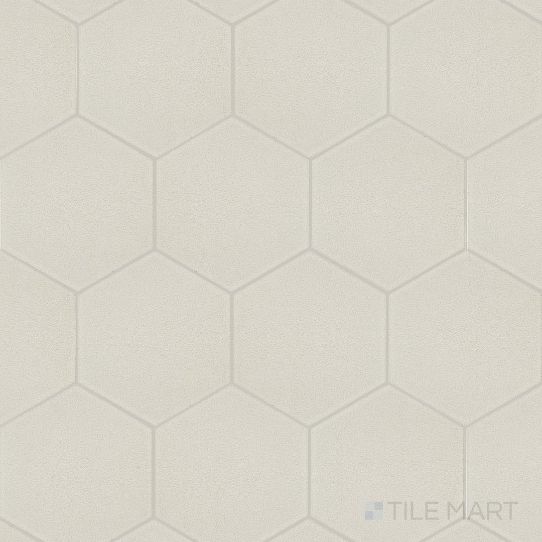 Shown as a complete tile, the Inyo Crema 8 inch hex satin glazed ceramic tile highlights its soft finish and geometric hex shape