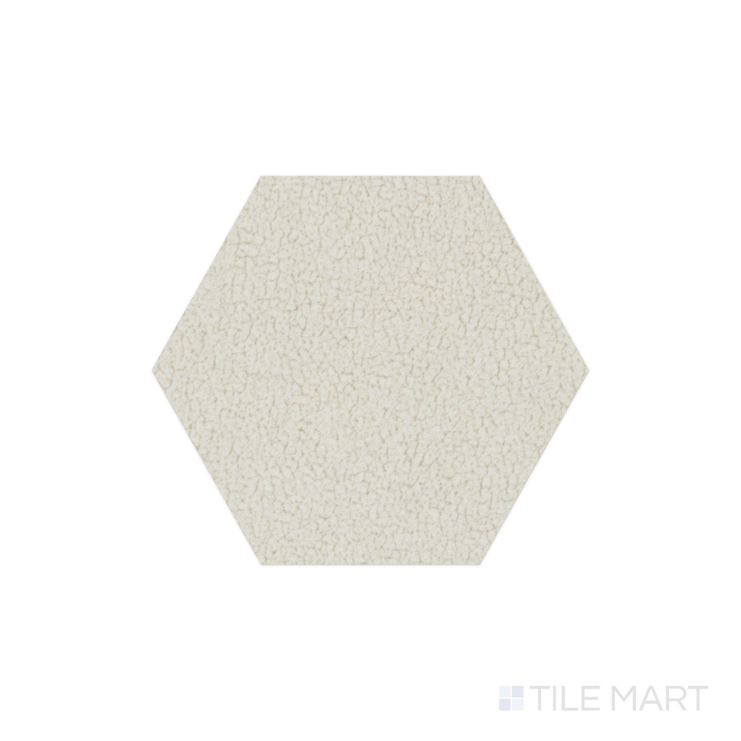 The overhead perspective highlights the Inyo Crema 8" hex satin glazed ceramic tile, displaying a warm, creamy beige hue with a smooth satin finish for a timeless and versatile look.