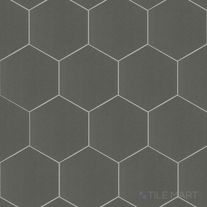 A flat-lay shot of Inyo Olive 8" hex satin glazed ceramic tiles, displaying their muted green shade and velvety satin glaze.