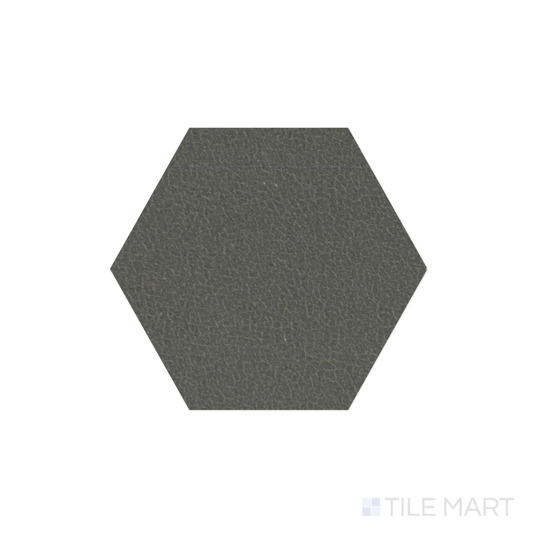 A top-down view of the Inyo Olive 8" hex satin glazed ceramic tile reveals a muted olive green shade with a soft satin finish, adding a natural and calming aesthetic to walls and floors.