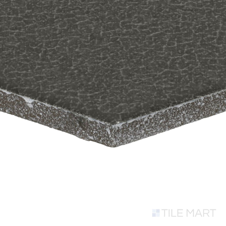 Close-up corner shot of Inyo Olive 8" Hex Satin Glazed Ceramic Tile, featuring its subtle green hues with a smooth satin finish.