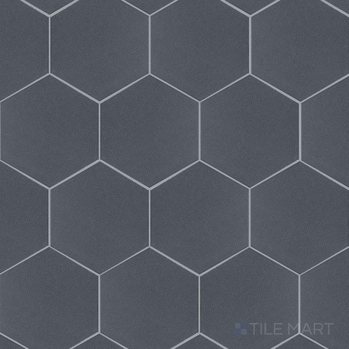 A detailed overview of Inyo Indigo 8" hex satin glazed ceramic tiles, emphasizing their deep blue tone and refined satin surface.